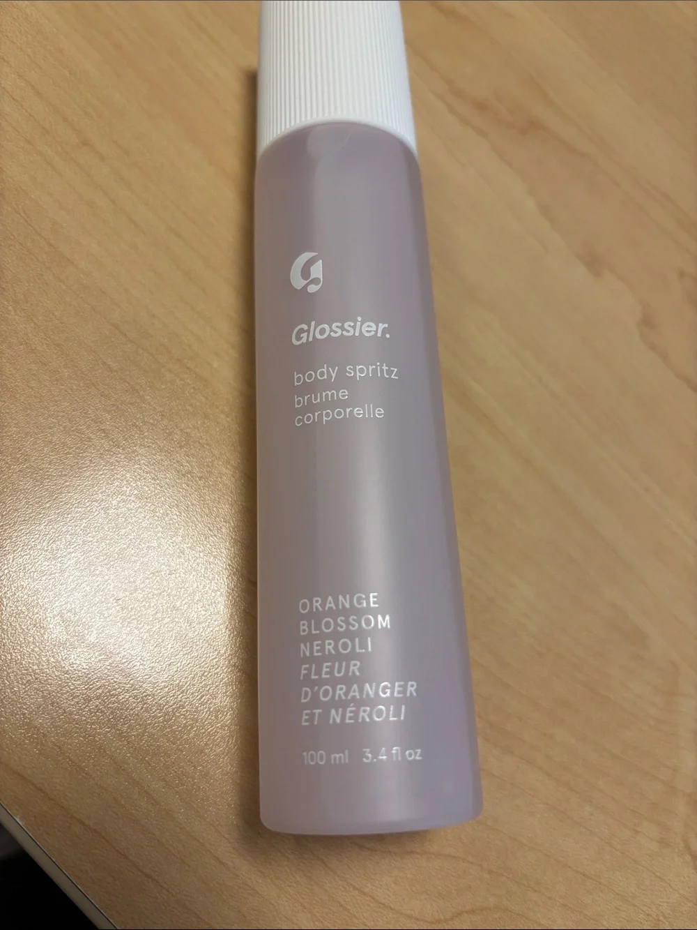 Glossier Light Pink Body Spray orange blossom neroli sprayed a few times